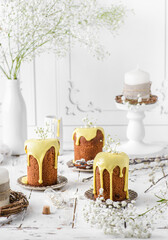 Easter cakes with icing on a light background