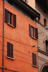 Fototapeta na wymiar Classic italian mediterranean orange house front in Bologna, Italy.