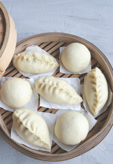 Homemade Chinese pastry. Chinese Steamed Bao. Made from unbleached flour of low to medium protein, choices of meat, vegan or bean paste fillings and round or any desired shapes