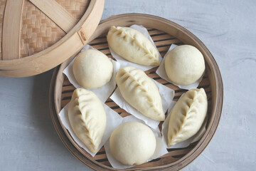 Homemade Chinese pastry. Chinese Steamed Bao. Made from unbleached flour of low to medium protein, choices of meat, vegan or bean paste fillings and round or any desired shapes