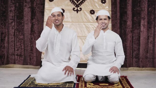 Happy Indian muslim men doing Adab greetings