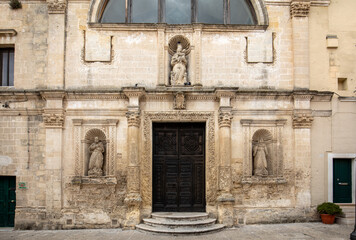 Fototapeta na wymiar Facade and entrance of one of the many old churches in Matera, Basilicata, Italy