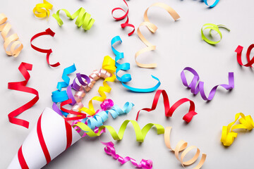 Party cone with serpentine on light background, closeup