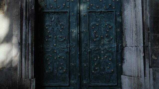 Incredibly beautiful turquoise color doors of the Church. A door with a beautiful decoration.