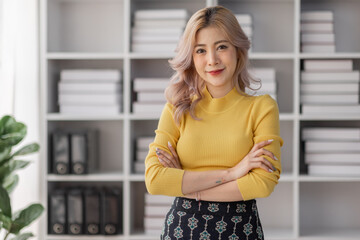 Young women asian confidence team leader business looking camera and smile in modern office room with blurred background group people