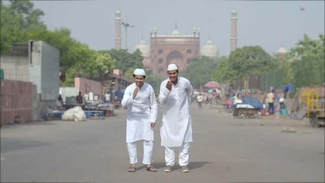 Two Muslim adab at Jama Masjid mosque in Delhi