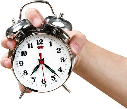 Man holding alarm clock in hand
