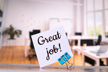 Great job with a smile written on a memo at the office