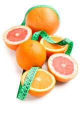 Cut oranges and green measuring tape on white background. Diet concept