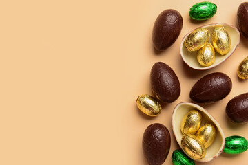Chocolate Easter eggs on beige background