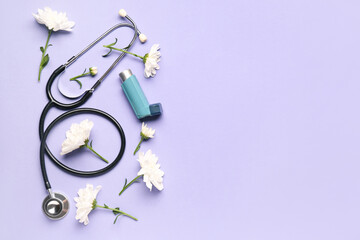 Asthma inhaler with flowers and stethoscope on lilac background