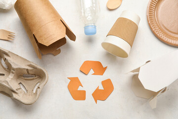 Recycling sign with garbage on white background