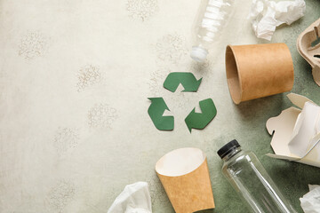 Recycling sign with garbage on grunge background