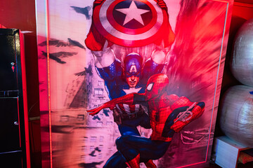Obraz premium Ternopil, Ukraine- March, 2023: Captain America with Spider Man poster in kids play room.