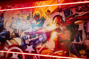 Naklejka premium Ternopil, Ukraine- March, 2023: Marvel super heroes poster in red play room.