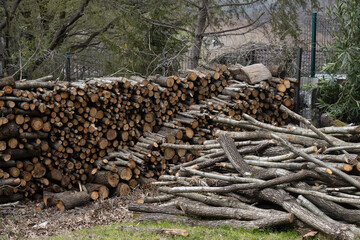wood logs piled on top of each other on a local remote farm