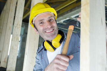 happy male builder looking at camera