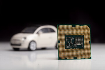 CPU chip with mini car. Computer chip in car industry