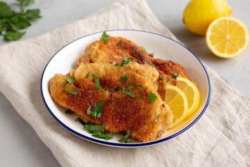 Homemade Chicken Cutlets on a Plate, side view.