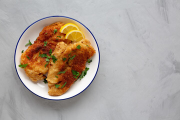 Homemade Chicken Cutlets on a Plate, top view. Flat lay, overhead, from above. Copy space.