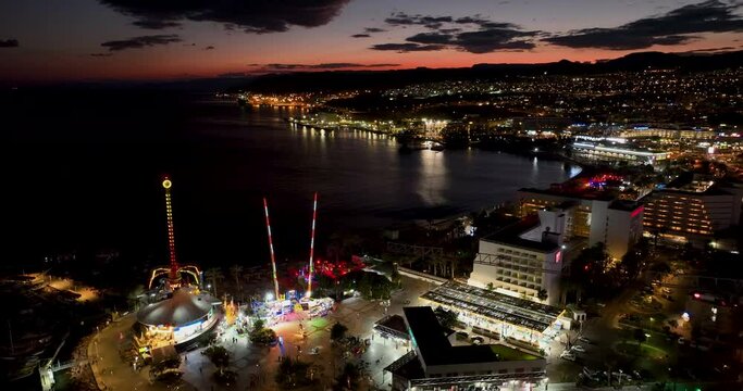 Aerial footage of the promenade in Eilat with the beautiful hotels in the evening. Shot in C4K Apple ProRes 422 HQ