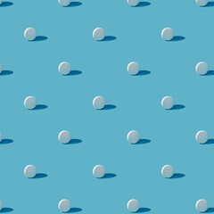 White pills on a blue background. Seamless pattern for background. Flat design medical pharmacy for website presentation packaging, flyer, business card cover.