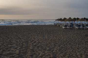 sunrise on the beach Surf sun loungers and awnings
