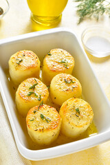 Fondant potatoes in baking dish
