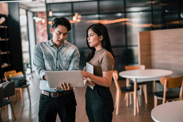 After class, college students discuss, share ideas and thoughts, and learn from each other. Modern and spacious areas in academic libraries that support a more tech-oriented and collaborative society