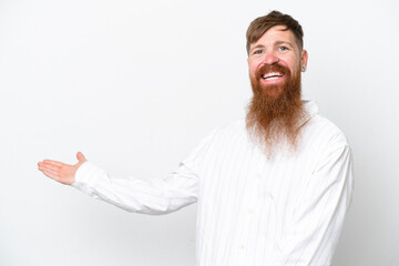 Redhead man with long beard isolated on white background extending hands to the side for inviting to come