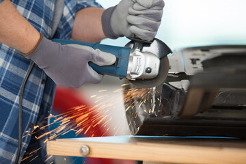 close up of hands holding grinder