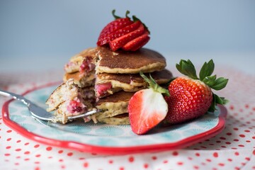 Closeup of strawberry pancakes on plate