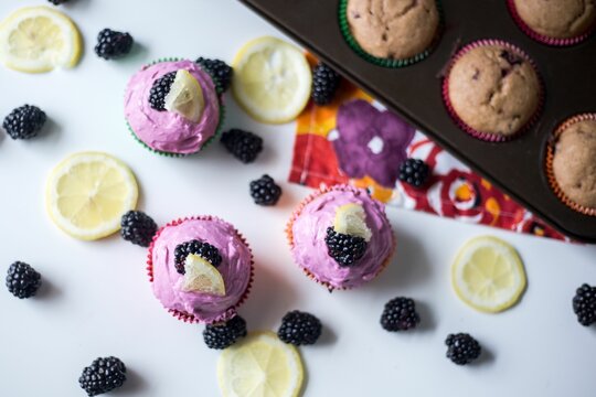 Closeup of purple cupcakes with blackberries