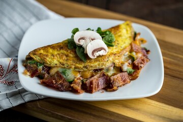 High angle closeup of a delicious Omelet with mushrooms