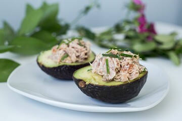Plate with stuffed avocados cut in half