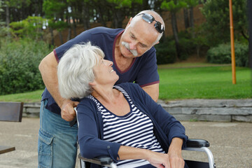 Fototapeta premium man and senior woman in a wheelchair