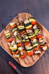 Vertical shot of vegetables kabobs on a grill