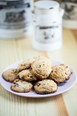 Closeup shot of gluten-free cookies with chocolate put on the table on the blurred background