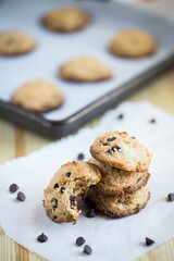 Closeup shot of gluten-free cookies with chocolate put on the table on the blurred background