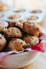 Vertical shot of small muffins on the wooden background