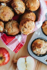 Vertical shot of small muffins on the wooden background