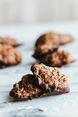 Closeup shot of no bake cookies dipped in chocolate on the marble kitchen counter