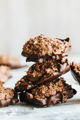 Deurstickers Vertical shot of chocolate cookies on the white background © Jeffrey Bethers/Wirestock Creators