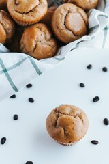 Vertical shot of blueberry muffins on the white background
