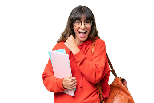 Young student caucasian woman over isolated background celebrating a victory