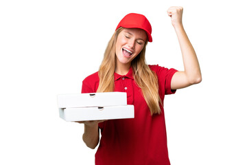 Young caucasian pizza delivery woman with work uniform picking up pizza boxes over isolated...