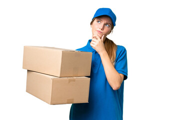 Delivery caucasian woman over isolated background having doubts