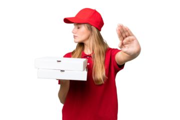 Young caucasian pizza delivery woman with work uniform picking up pizza boxes over isolated background making stop gesture and disappointed