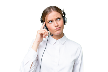 Telemarketer caucasian woman working with a headset over isolated background having doubts and with confuse face expression