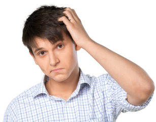 Young man scratching his head